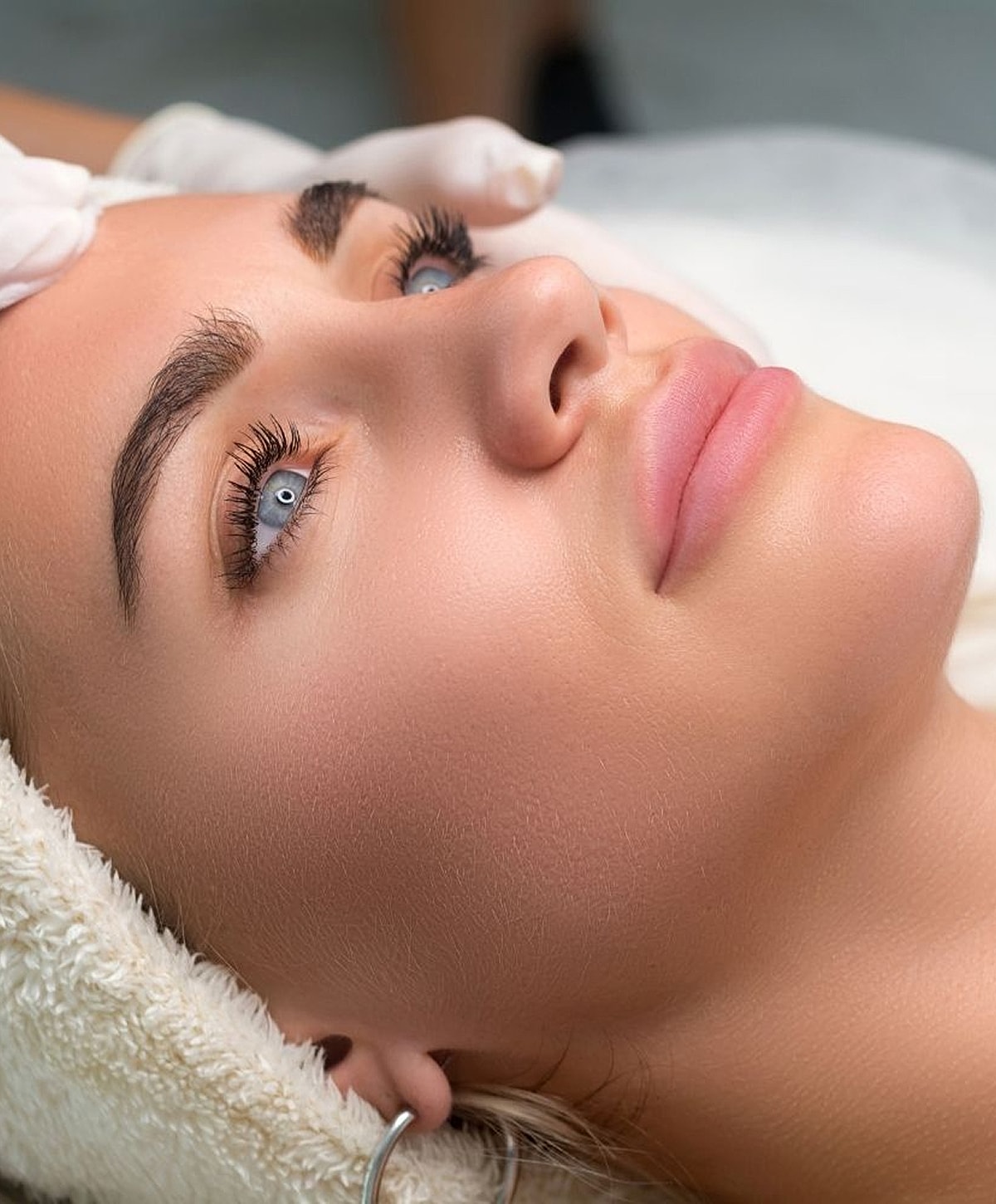 Woman receiving a facial treatment.